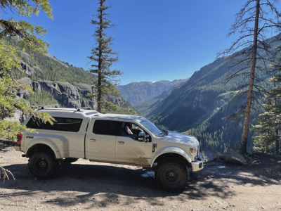 Silver Ford Super Duty Mountain Road