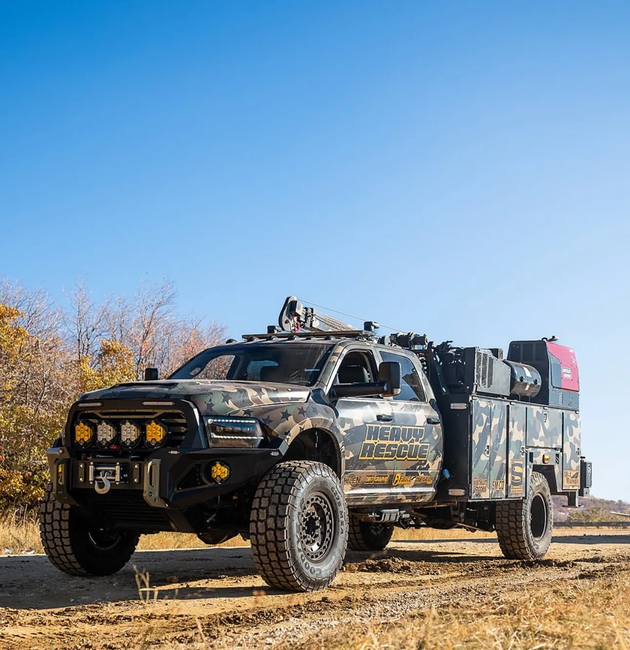 Camouflage Ram 5500 heavy rescue service truck with crane and super single wheels